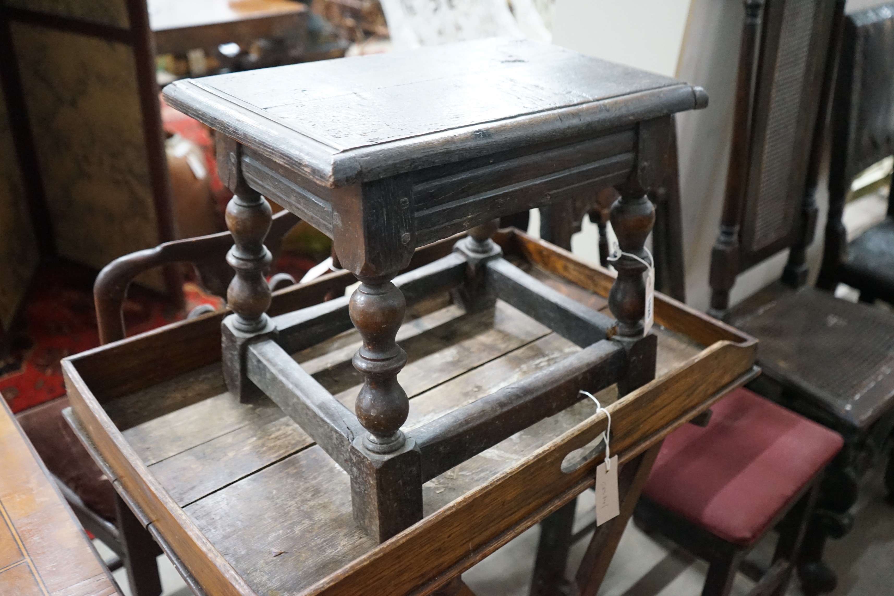 An early 18th century style oak joint stool, width 46cm, depth 30cm, height 38cm and a Victorian butler's tray on stand